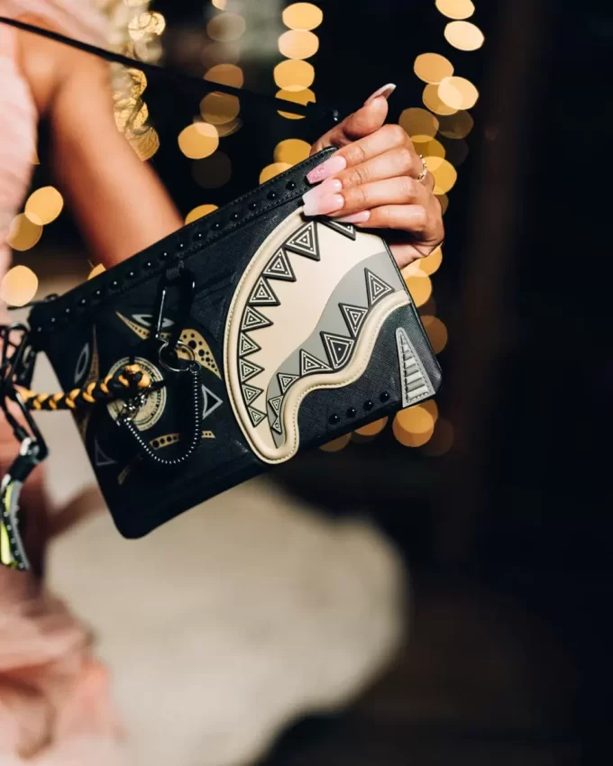 A.I. AFRICAN INTELLIGENCE SHARKS OF THE GOLD OCEAN CROSSOVER CLUTCH – SANDFLOWER COLLAB A.I. AFRICAN INTELLIGENCE SHARKS OF THE GOLD OCEAN CROSSOVER CLUTCH – SANDFLOWER COLLAB