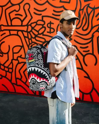 KEITH HARING SKATER SHARK DLXSR BACKPACK