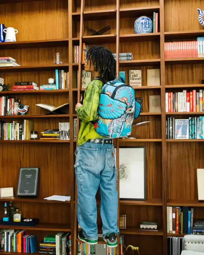 OFFICIAL BASQUIAT UNTITLED (FALLEN ANGEL) 1981 WING BACKPACK (DLXV) OFFICIAL BASQUIAT UNTITLED (FALLEN ANGEL) 1981 WING BACKPACK (DLXV)